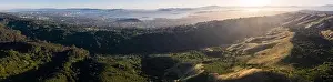 The last light of day illuminates the green, rolling hills just east of San Francisco Bay. This entire region turns green after winter storms