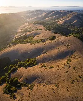 Bay Area Prints: The last light of day illuminates San Francisco Bay Area and the golden East Bay hills