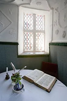 House Building Prints: Light streaming through window onto book on table Plas Mawr Conwy Wales UK