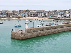 Lighthouse on harbour wall St Ives Cornwall on calm summers day drone, aerial