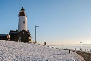 Water Tourism Prints: Lighthouse of Urk during winter with snow landscape in the Netherlands on a sunny day