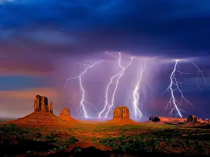 Dramatic Landscape Prints: Lightning over The Mittens and Merrick Butte, Monument Valley, Arizona Utah border, USA