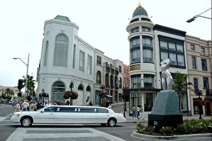 Beverly Hills Prints: Limo driving by intersection of Rodeo Drive and Via Rodeo Beverly Hills Rodeo Drive California