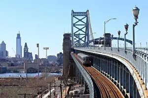 Camden Prints: A Lindenwold-bound PATCO speedline train on the Benjamin Franklin Bridge with Philadelphia