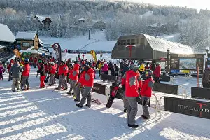 Snowboard Prints: A line of private ski instructors at the bottom of the Village Express ski lift on a clear cold morning