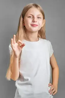 Excellent Prints: A little blonde girl shows the ok sign with her hand