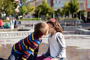 Kissing Prints: Little boy (6-7) and girl (4-5) kissing