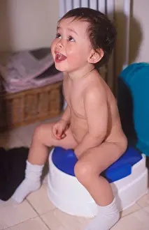 Potty Prints: Little boy having fun while potty training. Model released