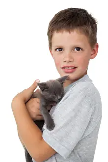 Asleep Prints: Little boy holding grey kitten smiling at camera