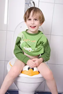 Infants Prints: little boy sitting on the toilet
