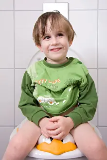 Infants Prints: little boy sitting on the toilet