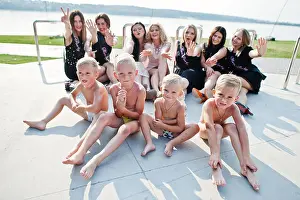 Four little boys in briefs with group of girls at hen party