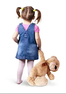 Preschooler Prints: Little child girl with toy bear on white, back view
