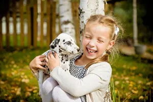Cuddling Prints: Little dog with happy owner spend a day at the park playing and having fun
