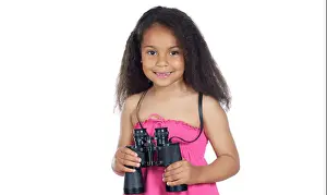 Little girl with binoculars on a over white background
