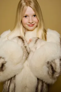 Caucasian Ancestry Prints: Little girl in a large fur coat