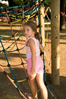 Little girl at the playground looking backwards