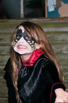 Infants Prints: Little Girl Wearing Halloween Face Paint and Costume Pulling an Scary Face