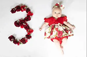 Little Girl Prints: Little newborn baby girl in red dress. 3 month old baby