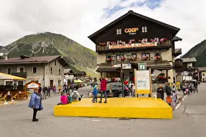 Ski Resort Prints: LIVIGNO, ITALY - AUGUST 1: Tourists walk on streets of duty-free area on 1 August 2016 in Livigno