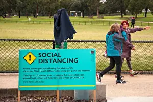 Time Out Prints: Local government notice in a suburban park promotes social distancing during the COVID-19 pandemic