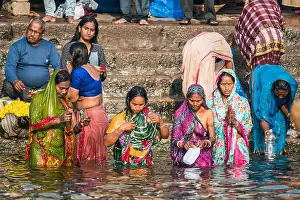 Uttar Prints: Local people have bath in the Ganga river, Varanasi, India, Asia