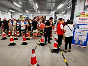 Retailer Prints: Local residents queue up for membership sign-up at the first brick-and-mortar store of Costco in the Chinese mainland