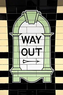 London, England, UK. Tiled sign at Warren Street tube station - way out