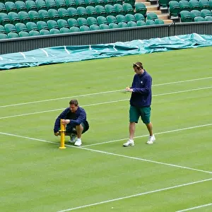 Wimbledon Prints: London, UK. 14th June 2013. Groundsmen check the level of the grass on Centre Court at the All England Club