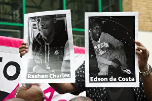 Cctv Prints: London, UK. 29th July, 2017. A protester holds up printed photographs of Edir (Edson) Da Costa (R)