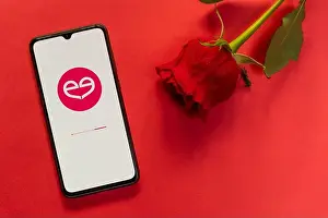 Finding Prints: London, UK - 6 january 2021: meetic dating app logo closeup on mobile phone with red rose
