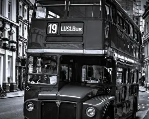 Public Transportation Prints: London, United Kingdom: a retro double decker bus is waiting in a station