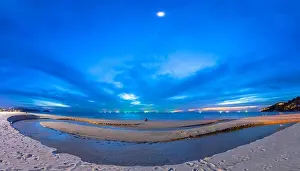 Karon Beach Prints: a lonely man sitting on the beach at twilight at Karon beach Phuket