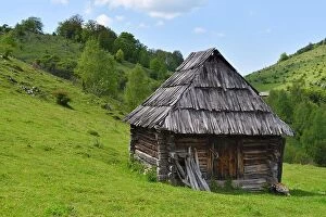 Images Dated 22nd May 2016: Lonely old wood house on a mountain hill against cloudy sky