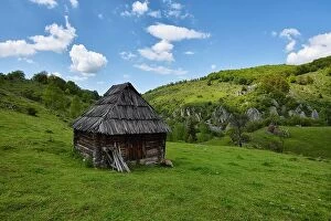 Images Dated 22nd May 2016: Lonely old wood house on a mountain hill against cloudy sky