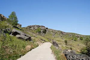 Moorland Prints: Long causeway footpath descending from Stanage Edge in the Peak District national park Derbyshire England UK