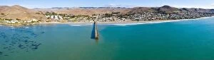 Aerial Landscape Collection: A long pier reaches out into the Pacific Coast in the quaint city of Cayucos, California