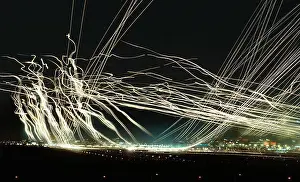 Taking Prints: long time and multiple exposure image of aircraft lights during take-offs