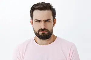 Bristle Prints: You look suspicious. Portrait of intense serious-looking handsome man with beard