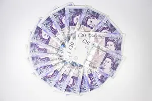 Bank Notes Prints: Looking down on a circle of Twenty pound notes on a table