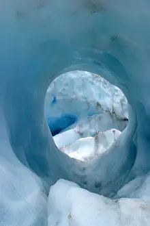 Chill Prints: Looking down into deep blue glacier hole