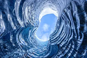 Glacial Prints: Looking up through a opening in a glacier cave in Iceland