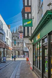 Business District Prints: Looking along Saint Margaret's Street to the Christchurch Gate entrance of Canterbury Cathedral in England