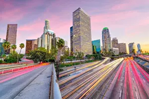 Los Angeles, California, USA downtown skyline over highways at dusk