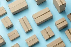 Deliver Prints: Lots of cardboard boxes pattern on a blue background. Top view
