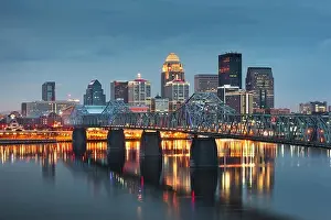 Louisville, Kentucky, USA downtown skyline on the Ohio River at dusk