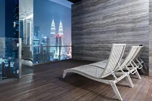 Cityscape Prints: Lounge Bar on rooftop bar or rooftop highrise with great night view of Kuala Lumpur