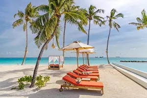 Sea Island Prints: Loungers, beach canopy sandy beach on a tropical island in Maldives