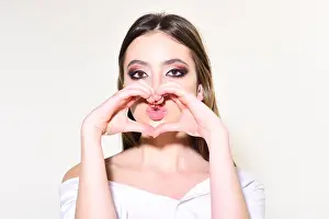 Hairdo Prints: Love concept and fashion look. Makeup smokey eyes for model with soft skin
