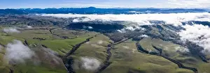 A low blanket of clouds drifts slowly over the rural landscape of central Oregon. This region is known for its beautiful rural communities